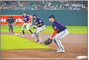  ?? Tommy Gilligan The Associated Press ?? This defensive shift from 2022 in which the Twins put three infielders between first and second base is banned this season.