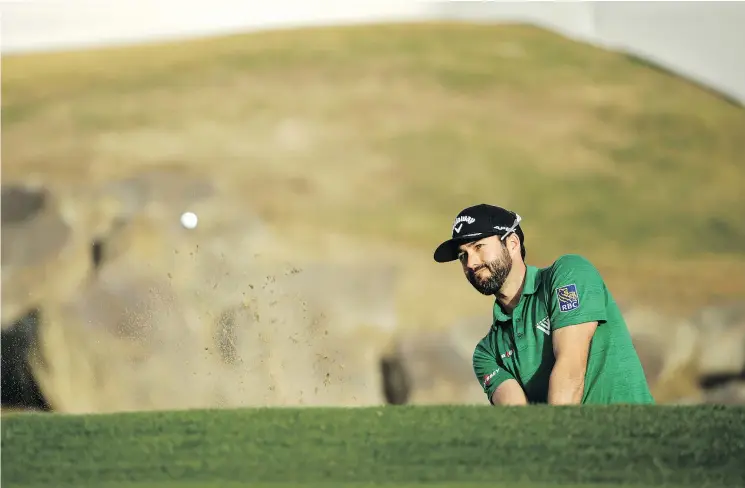  ?? — GETTY IMAGES ?? Adam Hadwin pitches to the 18th green during the final round of the Desert Classic at the Stadium Course in La Quinta, Calif.