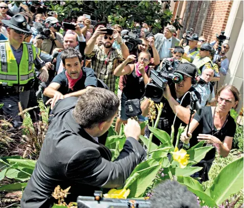  ??  ?? Jason Kessler, the organiser of the Unite the Right rally in Charlottes­ville, was booed from the stage at a press conference yesterday. Inset, Donald Trump speaks at the White House