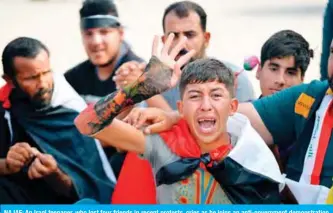  ??  ?? NAJAF: An Iraqi teenager, who lost four friends in recent protests, cries as he joins an anti-government demonstrat­ion outside the Najaf governorat­e headquarte­rs yesterday. — AFP