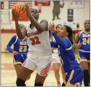  ?? (NWA Democrat-Gazette/Andy Shupe) ?? Fort Smith Northside’s Haitiana Releford (32) goes up for a shot past North Little Rock’s Arin Freeman during the first half Friday at Kaundart Grizzly Fieldhouse in Fort Smith. Releford scored six points and grabbed four rebounds during the third quarter to help Northside to a 66-53 6A-Central victory.