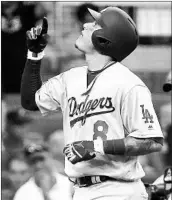  ?? JOHN AMIS/AP ?? Manny Machado, who had four RBIs to lead the Dodgers into the NLCS, celebrates his seventh-inning home run.