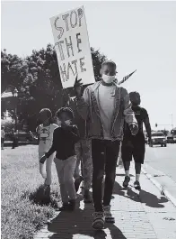  ??  ?? After George Floyd’s death, Jason Allende, 13, and his family joined protesters in Junction City, Kansas, on May 29, 2020.