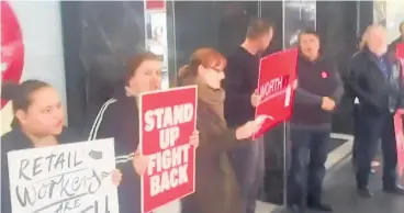  ??  ?? Retail workers protest in Auckland’s Queen St.