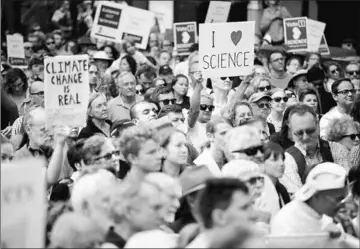  ?? — AFP photo ?? Supporters of science and research gather for the March for Science protest in Sydney.