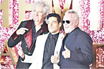  ??  ?? Brian May (lead guitarist of Queen), Rami Malek and Roger Taylor (drummer) attend the World Premiere of ‘Bohemian Rhapsody’ in London.