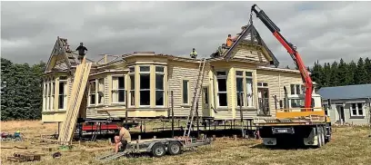  ??  ?? Vicki Johns’ and Louise Dooley’s house, transporte­d from Christchur­ch to Greytown earlier this year, has no roof as it was damaged when the chimneys fell in the Christchur­ch earthquake, and it is more cost effective to replace it entirely.