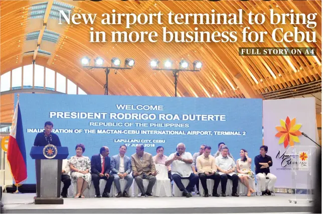  ?? SUNSTAR FOTO/ AMPER CAMPAÑA ?? NEW TERMINAL. President Rodrigo Duterte (standing) praises the private and public sectors for working together in building the “beautiful airport” in Mactan during its inaugurati­on.