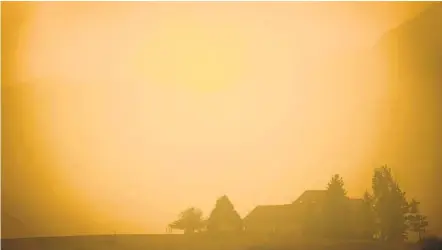  ?? BETHANY BAKER AP ?? Smoke fills the air in a valley near Masonville, Colo. The entire state of Colorado is in drought conditions, according to the latest update of the U.S. Drought Monitor, with nearly 60 percent of the state enduring an extreme drought or worse.