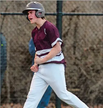  ?? DANA JENSEN/THE DAY ?? East Lyme’s Matt Malcom celebrates after hitting a solo home run during the sixth inning of the Vikings’ 6-2 victory over Waterford on Monday in the season opener for both rivals.