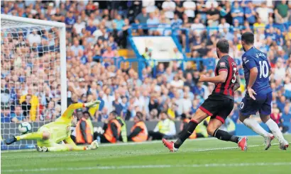  ?? Reuters ?? Chelsea’s Eden Hazard scores a goal against Bournemout­h during the Premier League match. —