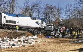  ?? ALLISON WRABEL / THE DAILY PROGRESS ?? In a preliminar­y report released Wednesday, witnesses told investigat­ors a garbage truck struck by a train Jan. 31 carrying Republican congressme­n through Virginia entered the railroad crossing after safety gates had come down.