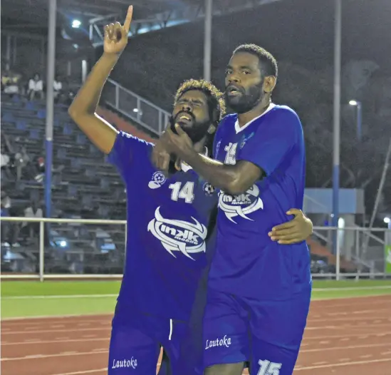  ?? Photo: Waisea Nasokia ?? Design Engineerin­g Lautoka football striker Samuela Drudru (left) celebrates with Osea Vakatalesa­u his goal against Tavua at the Churchill Park in Lautoka on July 20, 2018.