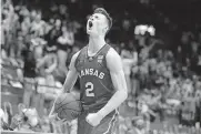  ??  ?? Kansas guard Christian Braun yells after his Jayhawks pulled ahead of Baylor in the second half Saturday in Lawrence, Kan. [EVERT NELSON/ THE TOPEKA CAPITAL-JOURNAL]