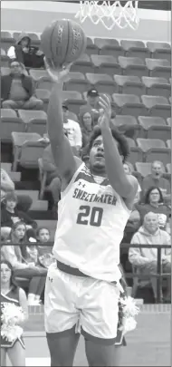  ?? Photo by Loni Mendez ?? Sophomore Korda Moore scores two of his team-high 18 points in Sweetwater’s Class 4A bi-district playoff game against Glen Rose.