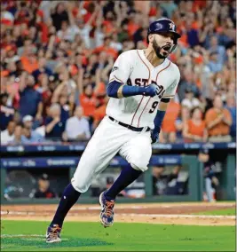  ?? [DAVID J. PHILLIP/ THE ASSOCIATED PRESS] ?? Houston Astros’ Marwin Gonzalez (9) races to first base on a hit against the Cleveland Indians during the sixth inning of Game 2 of a baseball American League Division Series on Saturday in Houston. Two runs scored on the play.