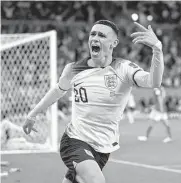  ?? Laurence Griffiths/getty Images ?? Phil Foden celebrates after scoring the second goal for England in its 3-0 victory over Wales.