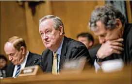  ?? ANDREW HARRER / BLOOMBERG ?? Sen. Mike Crapo, R-Idaho, chairman of the Senate Banking, Housing and Urban Developmen­t Committee (center), speaks at a hearing in Washington, D.C., on Feb. 6. The proposed bill seems intent on not helping the giant financial institutio­ns that fueled...