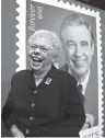  ?? THE ASSOCIATED PRESS ?? Joanne Rogers, widow of Fred Rogers, shares a laugh with friends Friday in front of a rendering of the Mister Rogers Forever Stamp at WQED’s Fred Rogers Studio in Pittsburgh.