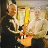  ?? Photo submitted ?? Current League Commission­er Jon Blackmore (left) presenting the League Trophy to this year’s winner, Jack Ball at the annual awards banquet at the Westline Inn.