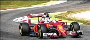  ?? SRDJAN SUKI/EPA ?? HABISKAN TOKEN: Pembalap Ferrari Sebastian Vettel menjalani sesi latihan kedua GP Italia kemarin WIB.