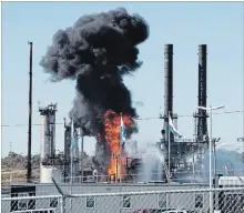  ?? STEPHEN MACGILLIVR­AY THE CANADIAN PRESS ?? Flame and smoke erupts from the Irving Oil refinery in Saint John, N.B., on Monday.