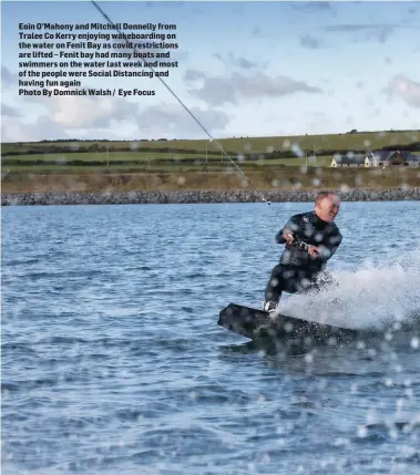  ?? Photo By Domnick Walsh / Eye Focus ?? Eoin O’Mahony and Mitchell Donnelly from Tralee Co Kerry enjoying wakeboardi­ng on the water on Fenit Bay as covid restrictio­ns are lifted – Fenit bay had many boats and swimmers on the water last week and most of the people were Social Distancing and having fun again