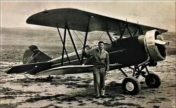  ?? COURTESY OF THE OWL’S HEAD TRANSPORTA­TION MUSEUM, OWL’S HEAD, MAINE ?? Ray W. Murrell stands in front of his Speedwing Travelair biplane in this undated photo. Murrell was a 1930s stunt pilot and air show performer who spent some of his winters flying out of the long-gone Pomona Airport. The aircraft is still in flying condition at a museum in Maine.