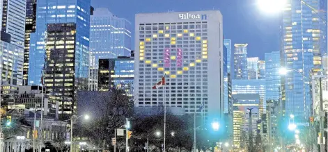  ?? AFP photo ?? File photo shows a heart is lit on a Hilton Hotel in downtown Toronto in support of healthcare workers. Travellers coming to Canada will have to quarantine in hotels for at least three days under strict supervisio­n and at their own expense, Trudeau announced.—