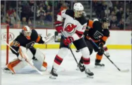  ?? TOM MIHALEK — THE ASSOCIATED PRESS ?? Flyers defenseman Ivan Provorov, here shadowing Devils forward Brian Boyle near Brian Elliott’s crease, finally turned in the kind of solid all-around game that the Flyers expect from him in Saturday’s 5-2 win over New Jersey.