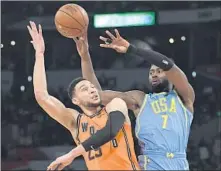  ?? Mark J. Terrill Associated Press ?? JAYLEN BROWN, right, led all scorers with 35 points, but Ben Simmons and the World Team won the Rising Stars game 155-124.