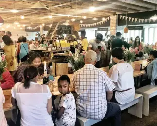  ??  ?? WEEKEND vibes at the popular Neighbourg­oods Market, in the middle of Joburg. Coleman|Bianca