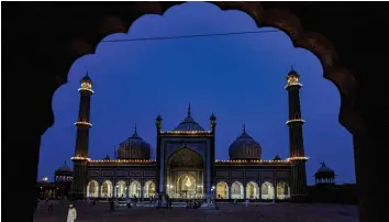  ?? — PTI ?? Jama Masjid illuminate­d on the eve of Id in New Delhi on Friday.