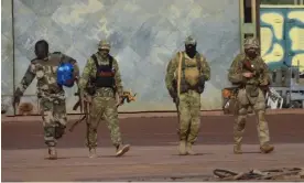  ?? Photograph: AP ?? Three Russian mercenarie­s and a Malian soldier on patrol in northern Mali in January 2022.