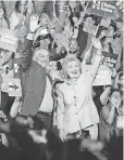  ?? GUSTAVO CABALLERO, GETTY IMAGES ?? Hillary Clinton and Tim Kaine rally in Miami on Saturday.