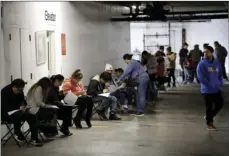  ?? SANCHEZ
AP PHOTO/MARCIO JOSE ?? In this March 13, file photo, unionized hospitalit­y workers wait in line in a basement garage to apply for unemployme­nt benefits at the Hospitalit­y Training Academy in Los Angeles.