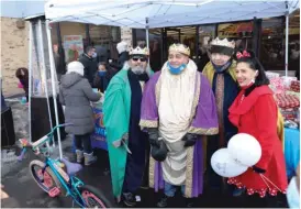  ?? ANTHONY VAZQUEZ/SUN-TIMES PHOTOS ?? Volunteers at the celebratio­n dressed as the three kings.