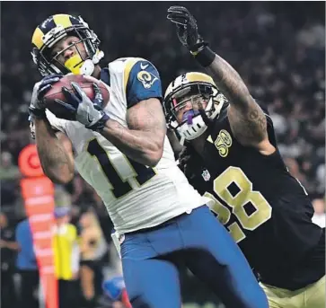  ?? Wally Skalij Los Angeles Times ?? TAVON AUSTIN of the Rams catches a pass in front of cornerback B.W. Webb of the New Orleans Saints last season, the first touchdown throw of Jared Goff’s career. Austin caught a career-best 58 passes last year.