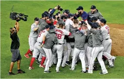  ?? WENDELL CRUZ-USA TODAY SPORTS ?? THE BOSTON RED SOX CELEBRATE beating the New York Yankees in game four of the 2018 ALDS playoff baseball series at Yankee Stadium.