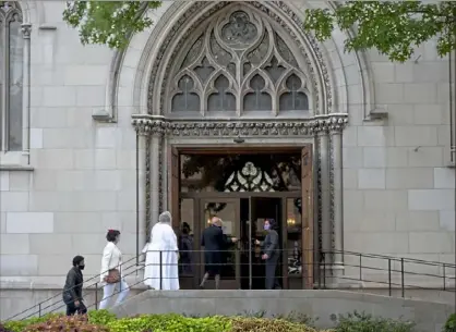  ?? Pam Panchak/ Post- Gazette ?? Mourners of Pittsburgh attorney Eric Springer enter St. Paul Cathedral in Oakland for a memorial service in his honor Friday.