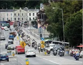  ??  ?? The convoy of motorbikes making its way across Kent Bridge in Fermoy during the 2017 Mick O’Regan Memorial Run in aid of Pieta House.