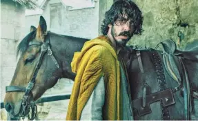  ?? PROVIDED BY ERIC ZACHANOWIC­H/A24 FILMS ?? Sir Gawain (Dev Patel) King Arthur’s headstrong nephew, runs into ghosts, giants and thieves on his epic quest to confront the formidable Green Knight in David Lowery's “The Green Knight.”