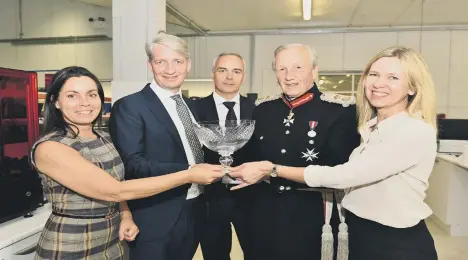  ??  ?? HONOUR: From left, Amanda Keating, production director, Paul Holt, managing director, Agustin Soriano, marketing director, Sir Hugh Duberly and Sally Tipping, sales director with the Queen’s Award.