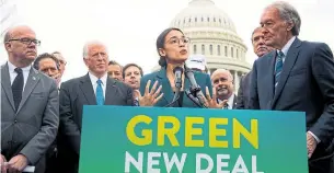  ?? SAUL LOEB AFP/GETTY IMAGES FILE PHOTO ?? The basic idea of the “Green New Deal,” championed by Democrats including Rep. Alexandria Ocasio-Cortez, centre, is for transforma­tive government spending to create jobs, build clean infrastruc­ture, retrofit buildings and support green technology.