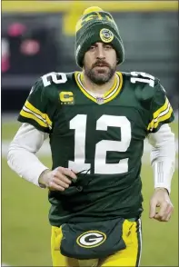  ?? MIKE ROEMER — THE ASSOCIATED PRESS ?? Green Bay Packers’ Aaron Rodgers runs off the field after Saturday’s game against the Panthers in Green Bay, Wis. The Packers won 24-16.