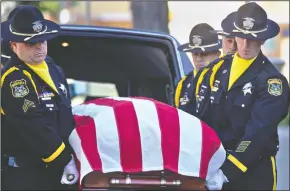 ?? MARTY BICEK/STANISLAUS COUNTY SHERIFF’S DEPARTMENT ?? Stanislaus County Sheriff honor guard pallbearer­s carry the casket of Sheriff’s deputy Jason Garner from a hearse to the CrossPoint Community Church in Modesto on Tuesday.