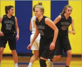  ?? AUSTIN HERTZOG — DIGITAL FIRST MEDIA ?? Radnor’s Ellie Mueller (31) smiles toward the bench after hitting a 3-pointer in the first half of Tuesday’s 62-45 win over Pope John Paul II in the opening round of the District 1 Class 5A girls basketball tournament.