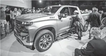  ?? TANNEN MAURY/EPA-EFE ?? General Motors shows off the redesigned Chevrolet Silverado at the 2018 Detroit auto show.