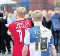  ??  ?? Mourners wore football shirts