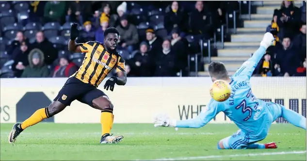  ?? PICTURES: Action Images ?? NOU DOUBT: Nouha Dicko despatches the ball past Ipswich keeper Bartosz Białkowski to put Hull ahead early in the second half